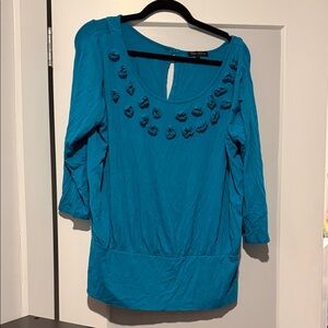 Elegant Teal Blouse with Floral Accents